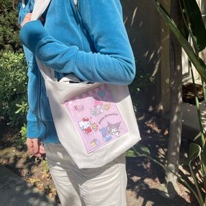 Hand made up cycled denim Hello Kitty cross body bag.